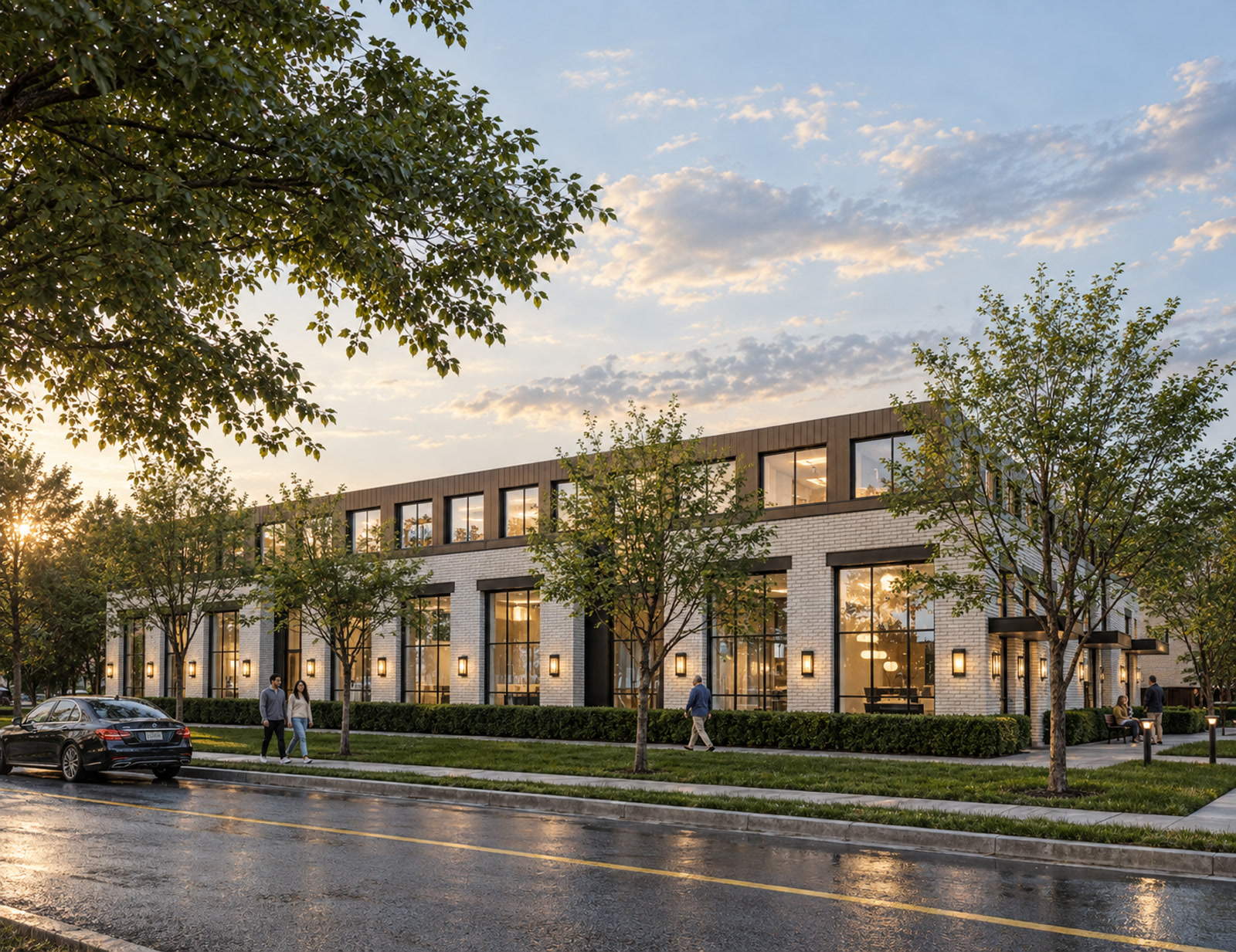 Windsor Mixed-Use Development — Windsor, Ontario · Side elevation with tall windows, white brick walls and a tree-lined sidewalk